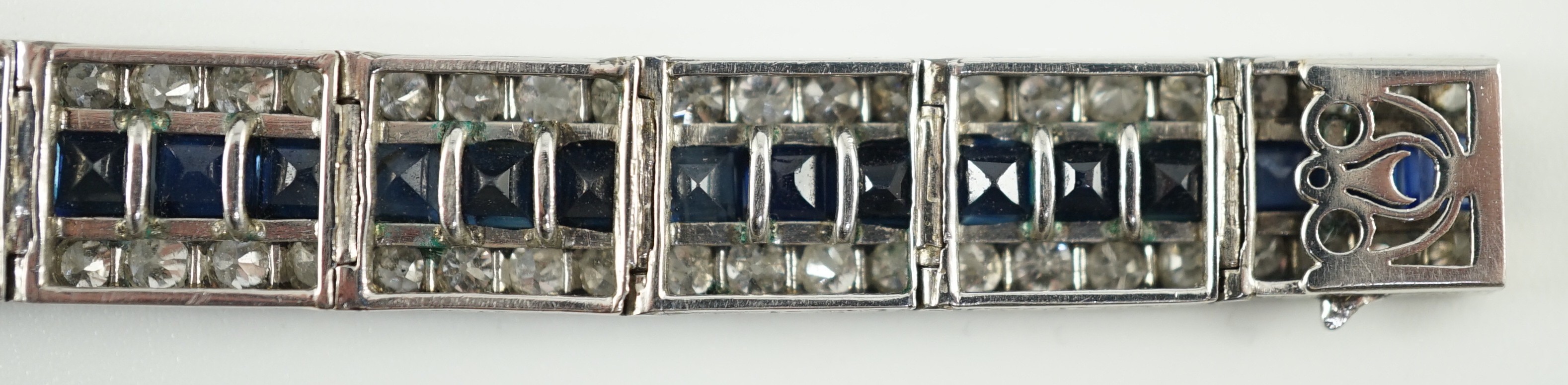 A 1920’s white gold, sapphire and diamond set triple line bracelet